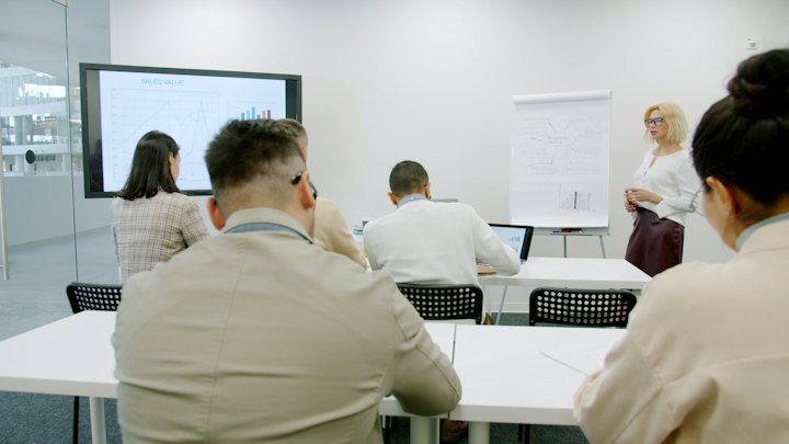 A trainer leading a workshop for a team